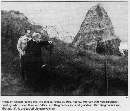 President Clinton looked over the cliffs at Pointe du Hoc